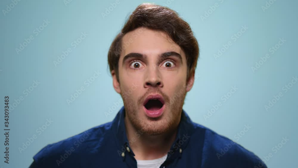 Surprised man looking at camera. Handsome guy with wow expression Surprised man looking at camera. Handsome guy with wow expression