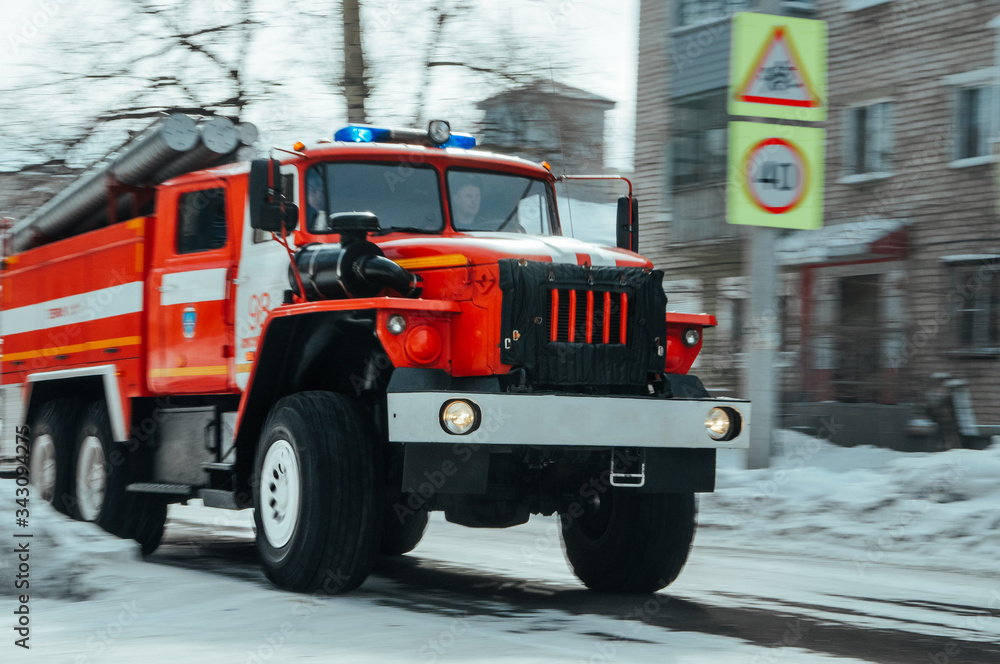 Fototapeta premium Fire truck rushing to a call