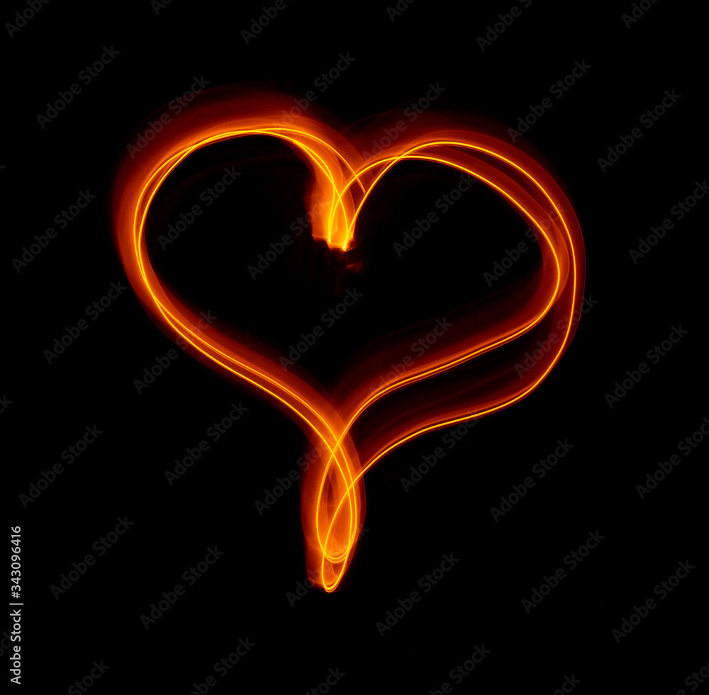 Light wave trail path, vibrant neon gold color in abstract swirls on a black background Light wave trail path, vibrant neon gold color in abstract swirls on a black background