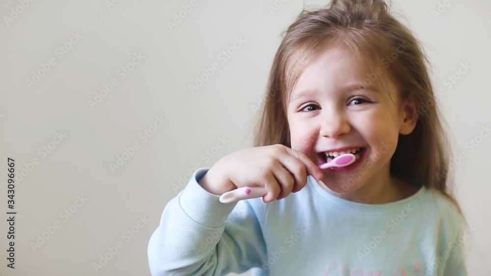 child brush their teeth. dental hygiene. happy little girl child brush their teeth. dental hygiene. happy little girl