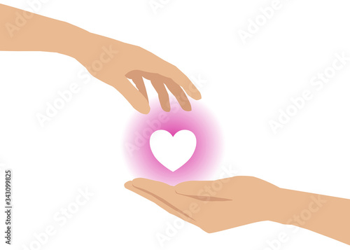 There’s a hand giving a heart to another one’s hand. Concept about love, care, sharing, donation, human kindness.