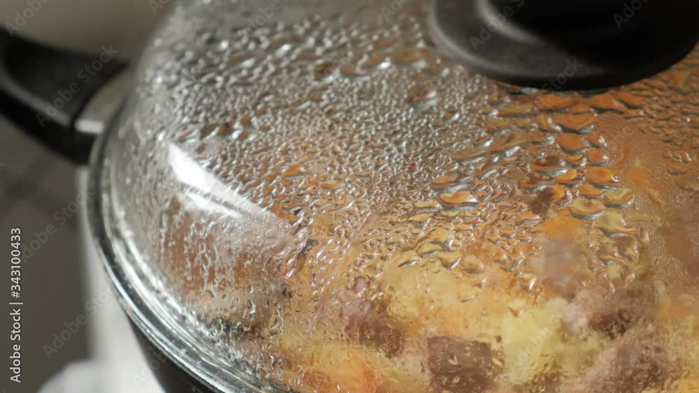 Cooking lid with evaporation. Steam on the lid close-up. Cooking Cooking lid with evaporation. Steam on the lid close-up. Cooking