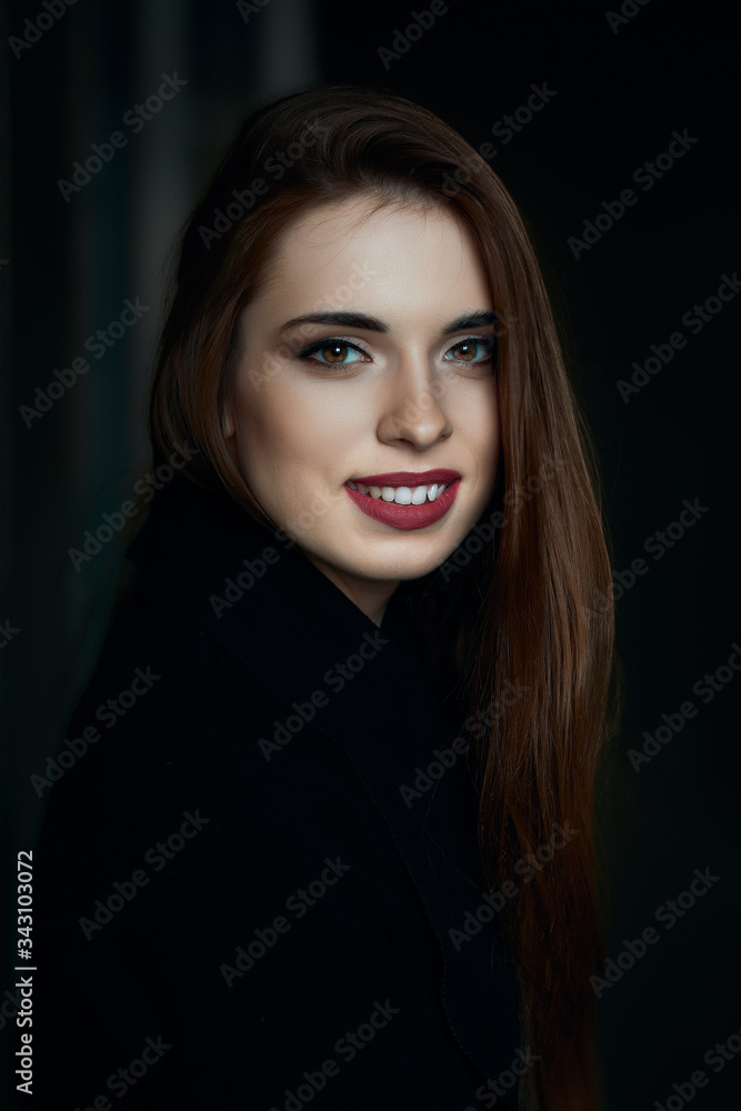 Low key portrait of beautiful girl with natural make up and red lips Low key portrait of beautiful girl with natural make up and red lips