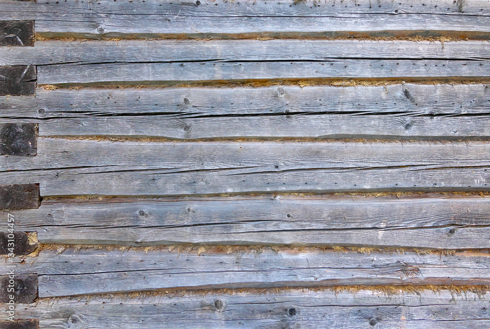 Rough log wall with corner joint. Rough log wall with corner joint.
