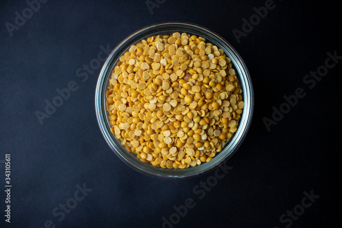 Bowl of Toor Dal/Yellow Dal, isolated, yop view, black background, close up.