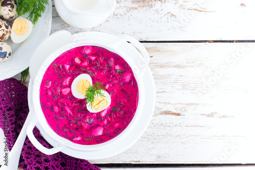 Traditional cold summer beetroot soup with vegetables, top view, selective focus, copy space