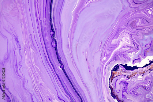 Fluid art texture. Backdrop with abstract swirling paint effect. Liquid acrylic picture that flows and splashes. Mixed paints for baner or wallpaper. Purple, lilac and golden overflowing colors