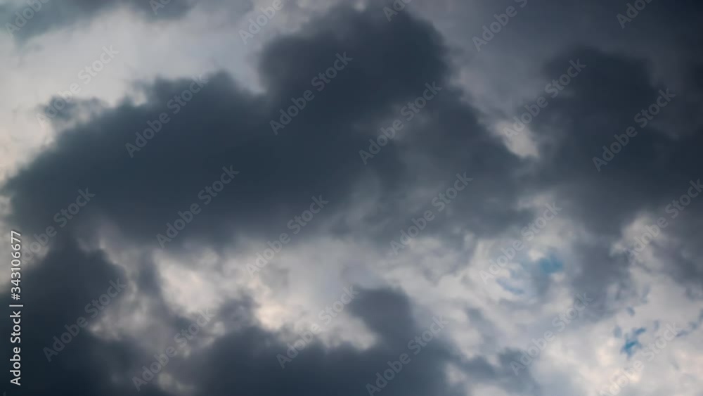 Dark rain cloud moving in the sky. Rain cloud moving in the early rainy season. Dark rain cloud moving in the sky. Rain cloud moving in the early rainy season.