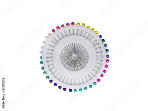 Colorful pin set in rainbow mood isolated on white background without shadow. Top view of Wheel of Sewing Pins