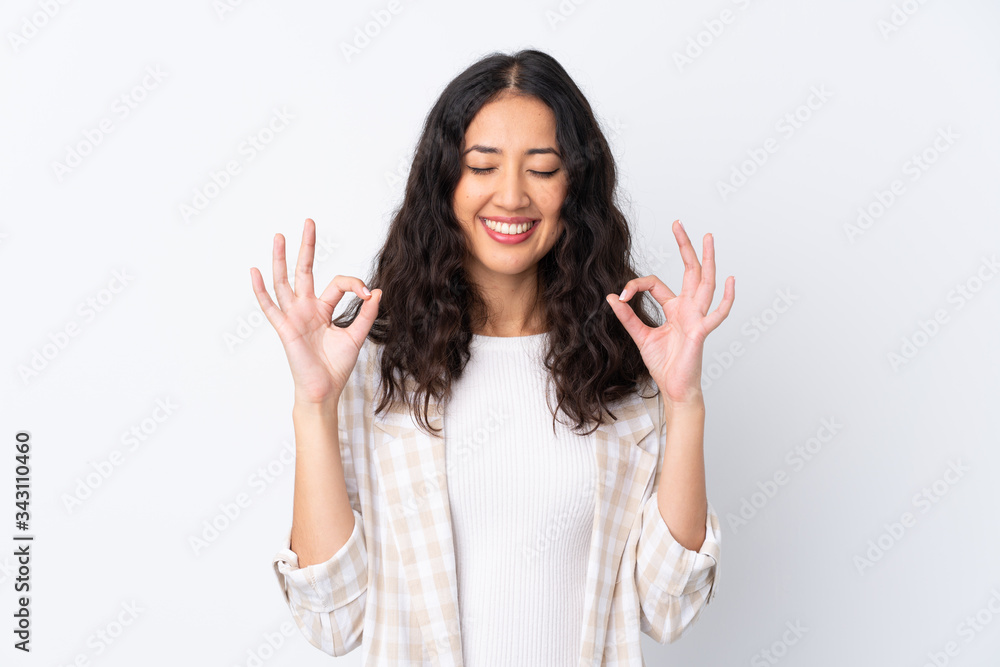 Mixed race woman over isolated white background in zen pose Mixed race woman over isolated white background in zen pose