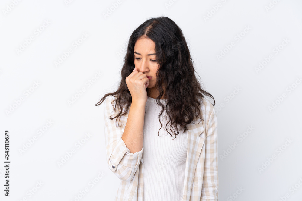 Mixed race woman over isolated white background having doubts Mixed race woman over isolated white background having doubts