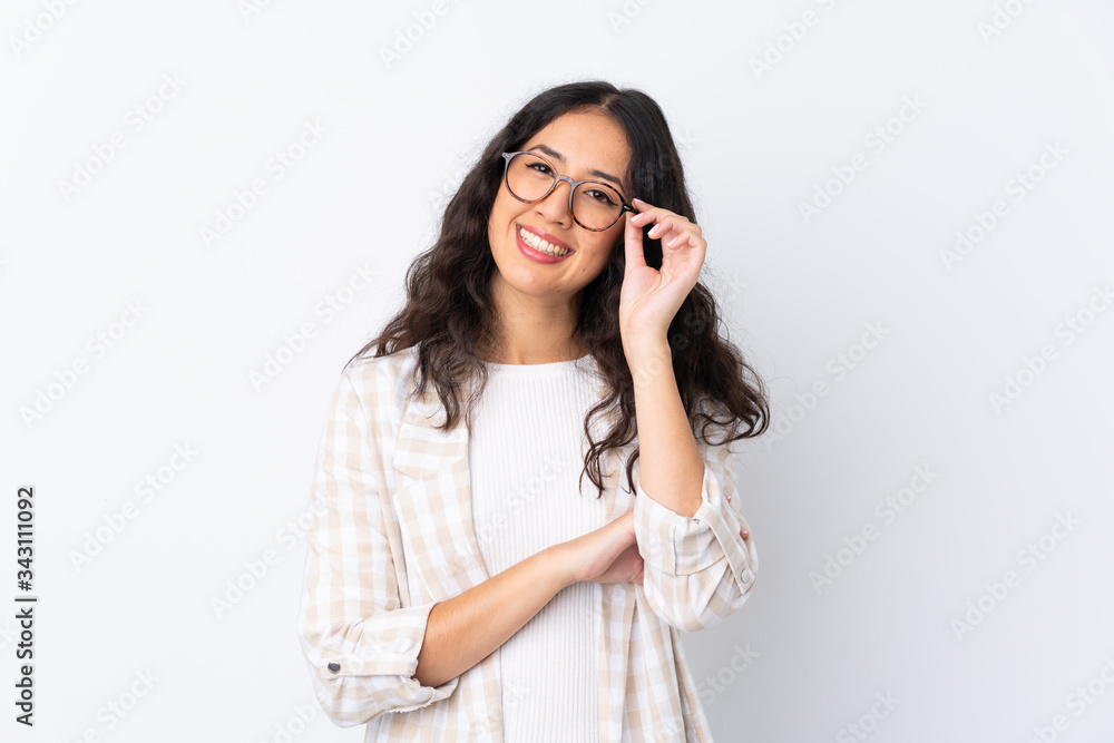 Mixed race woman over isolated white background with glasses and happy Mixed race woman over isolated white background with glasses and happy