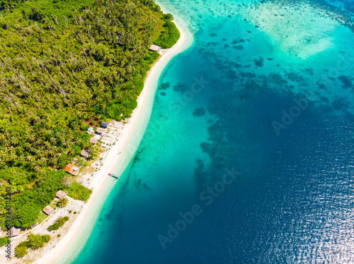 Aerial view tropical paradise pristine beach rainforest blue lagoon bay coral reef caribbean sea turquoise water at Banyak Islands Indonesia Sumatra remote travel adventure away from it all © fabio lamanna