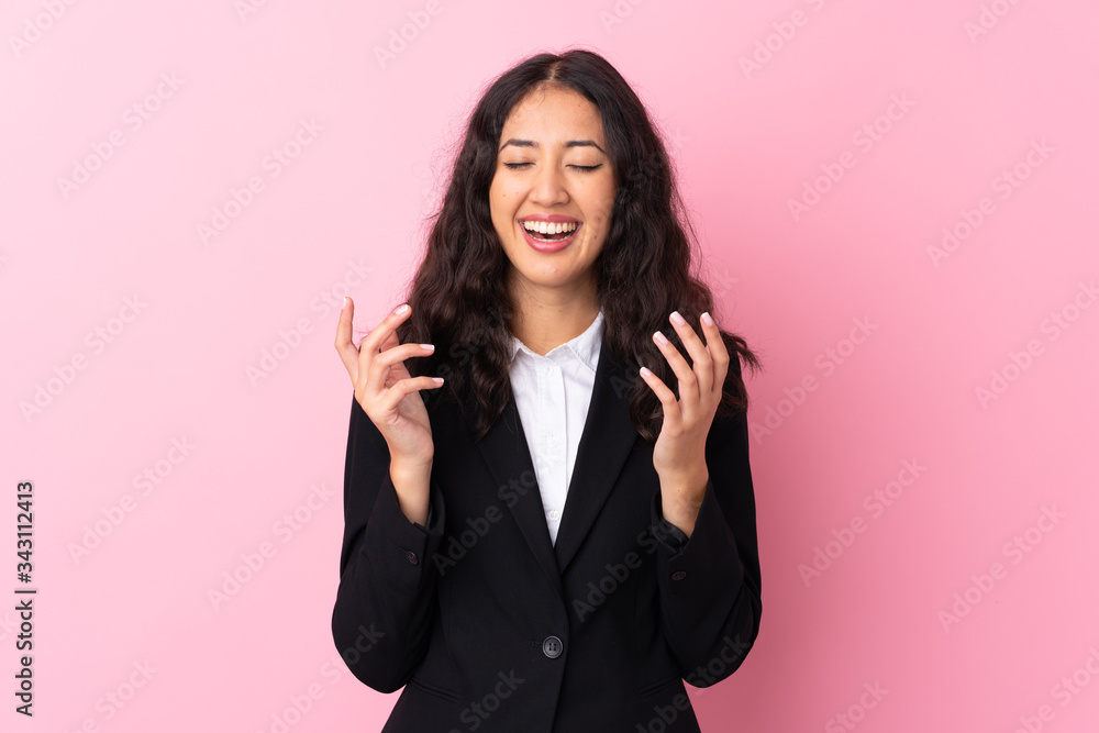 Mixed race business woman over isolated pink background laughing Mixed race business woman over isolated pink background laughing