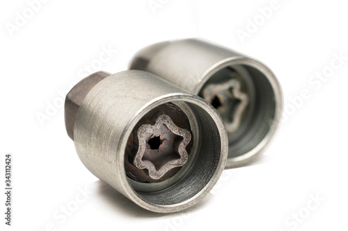 Photos key lock for wheel nuts secret close up.