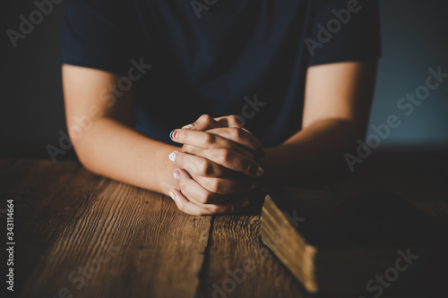 Praying hands of teen girl