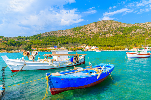 Colourful Greek fishing boats on turquoise sea in Posidonio bay  Samos island  Greece
