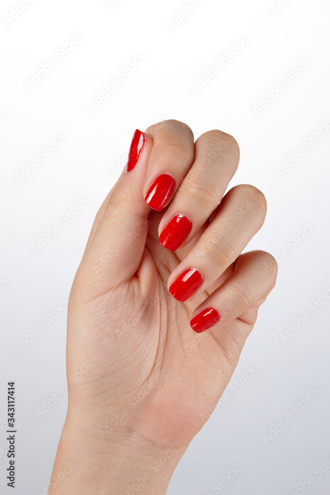 fingernails painted in glossy red. fingernails painted in glossy red.