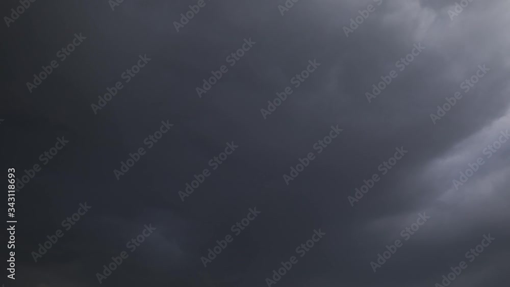 Time Lapse of stormy sky with light sky gradually in transition to almost black as the sunlight is obscured. Time Lapse of stormy sky with light sky gradually in transition to almost black as the sunlight is obscured.
