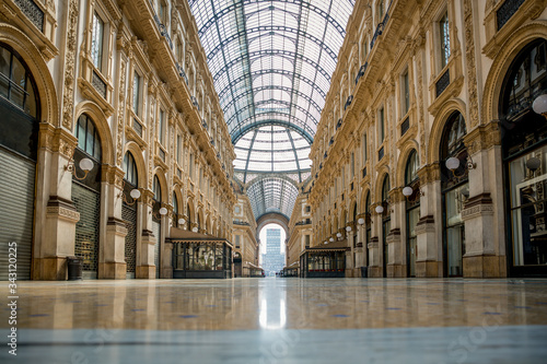 Empty streets due to covid-19 virus. Lockdown in european town. Strange spring in Milan galleria Vittorio Emanuele Italy. Report from deserted cities people are locked up. Nobody can go out all closed