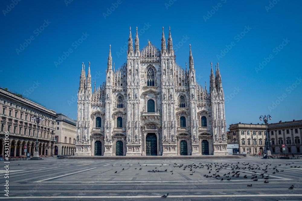 Empty streets due to covid-19 virus. Lockdown in european town. Strange spring in Milan piazza Duomo Italy. Report from deserted cities people are locked up. Nobody can go out all are closed at home