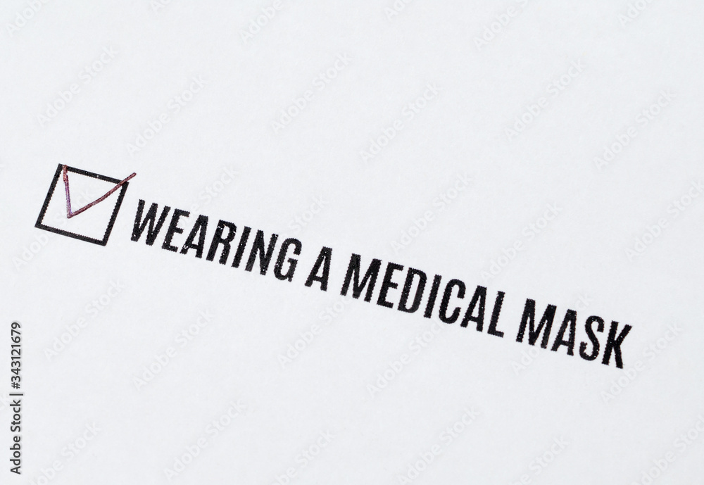 Fototapeta premium Wearing a medical mask - checked in the questionnaire. Rules of conduct during an epidemic.