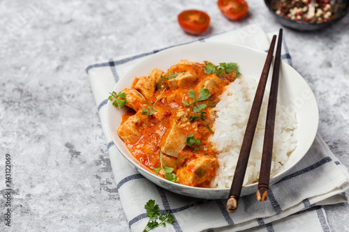 bowl with spicy chicken, vegetables and rice