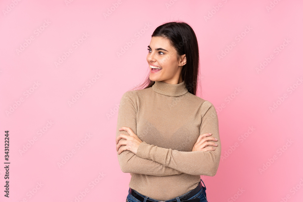 Fototapeta premium Young woman over isolated pink background happy and smiling