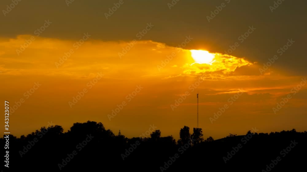 Time lapse of sun rays emerging through clouds in sunset Time lapse of sun rays emerging through clouds in sunset