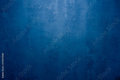 Abstract grunge decor. Beautiful dark blue stucco wall background. Space for designing and inserting text. © kheartmanee