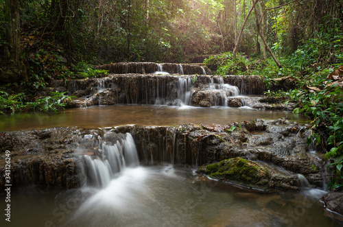 Landscape photo, Huay Ton Phung Waterfall, beautiful waterfall in deep forest at Phayao province, Thailand © apiwat