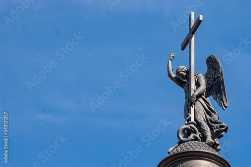 The horizontal frame. Statue of an angel with a cross, located on top of the Alexandrian column in the Palace square