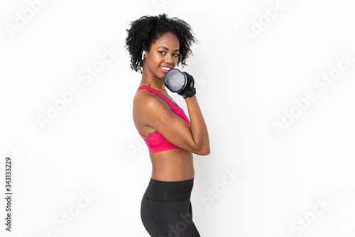 Young African American woman isolated on white background making weightlifting