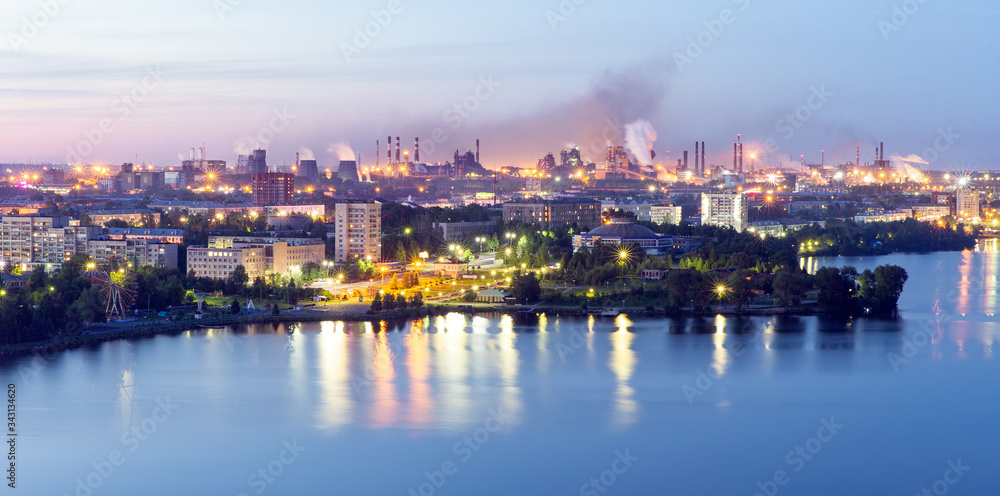 View of the evening city by the river. White nights in the city