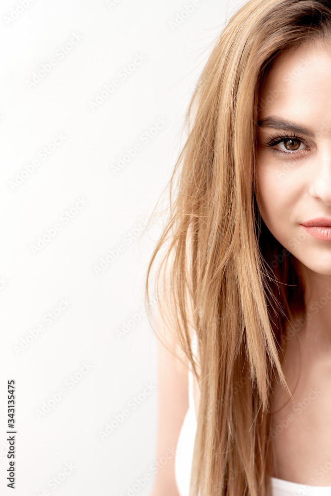 Girl holds knife with shaving foam in front of her face on white background. Depilation or epilation concept. Girl holds knife with shaving foam in front of her face on white background. Depilation or epilation concept.