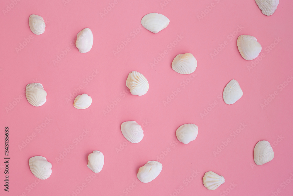 abstract background. Pattern of white sea shells on pink. abstract background. Pattern of white sea shells on pink.