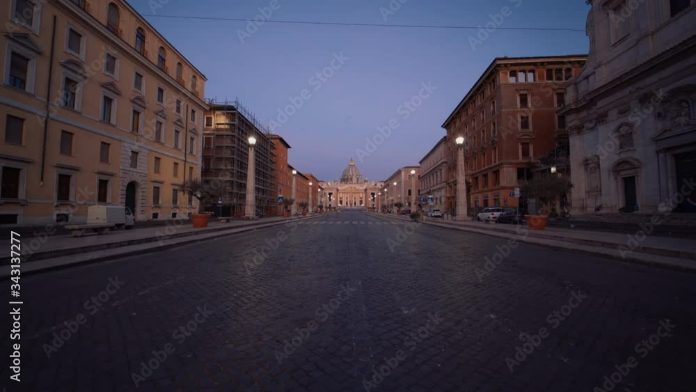 Dolly shot over the Via della Conciliazione street, towards the St. Peter's Square and the Basilica Papale di San Pietro, during dusk, in Rome, Italy Dolly shot over the Via della Conciliazione street, towards the St. Peter's Square and the Basilica Papale di San Pietro, during dusk, in Rome, Italy