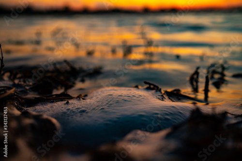 close up Waves breaking through freshwater swamps causing banks to flood.