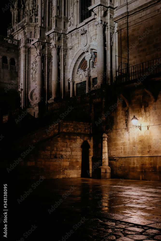 Facade of Cathedral of Santiago de Compostela on a cloudy day at night. Galicia, Spain