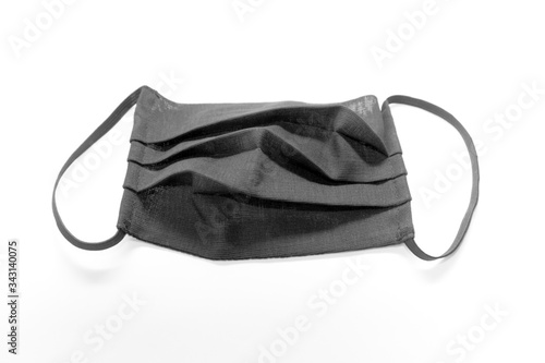 Black medical mask on a white background for prevention and protection from coronavirus infection