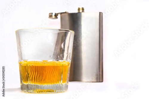 flask and glass tumbler isolated on a white