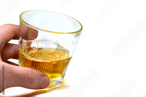 Tumbler Highball in man hand isolate on white