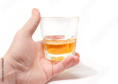 Tumbler Highball in man hand isolate on white