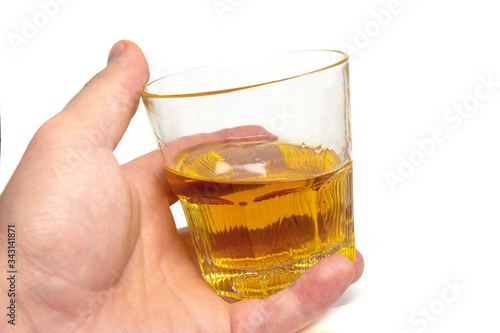 Tumbler Highball in man hand isolate on white