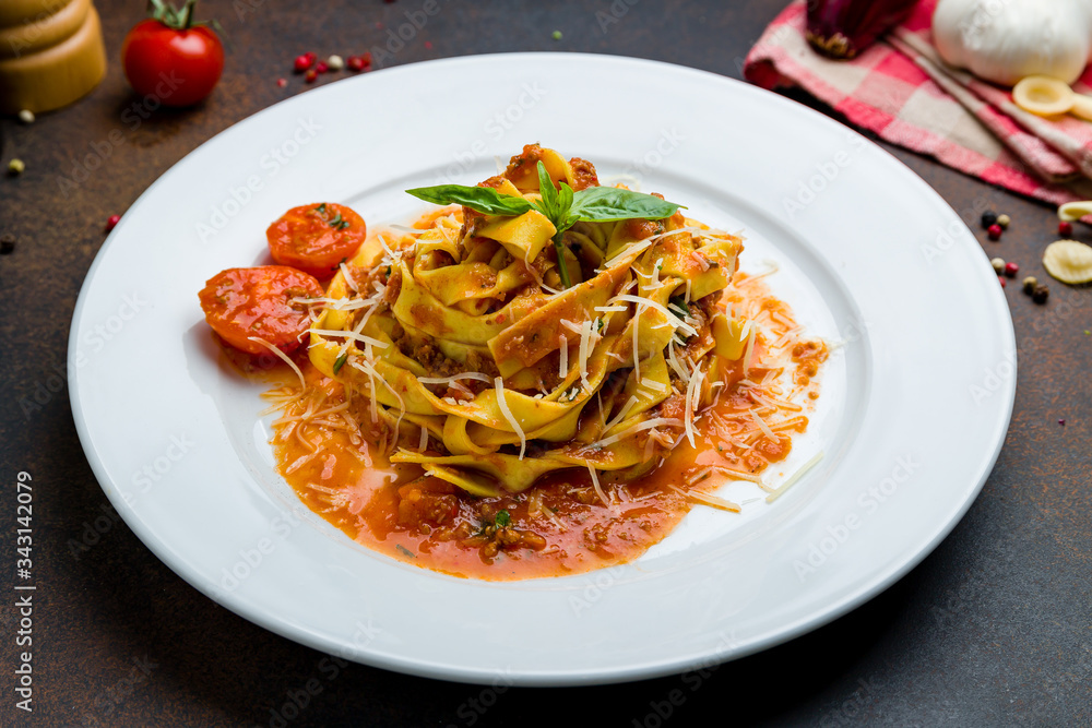 Pasta Bolognese with meat and tomato sause on white plate Pasta Bolognese with meat and tomato sause on white plate