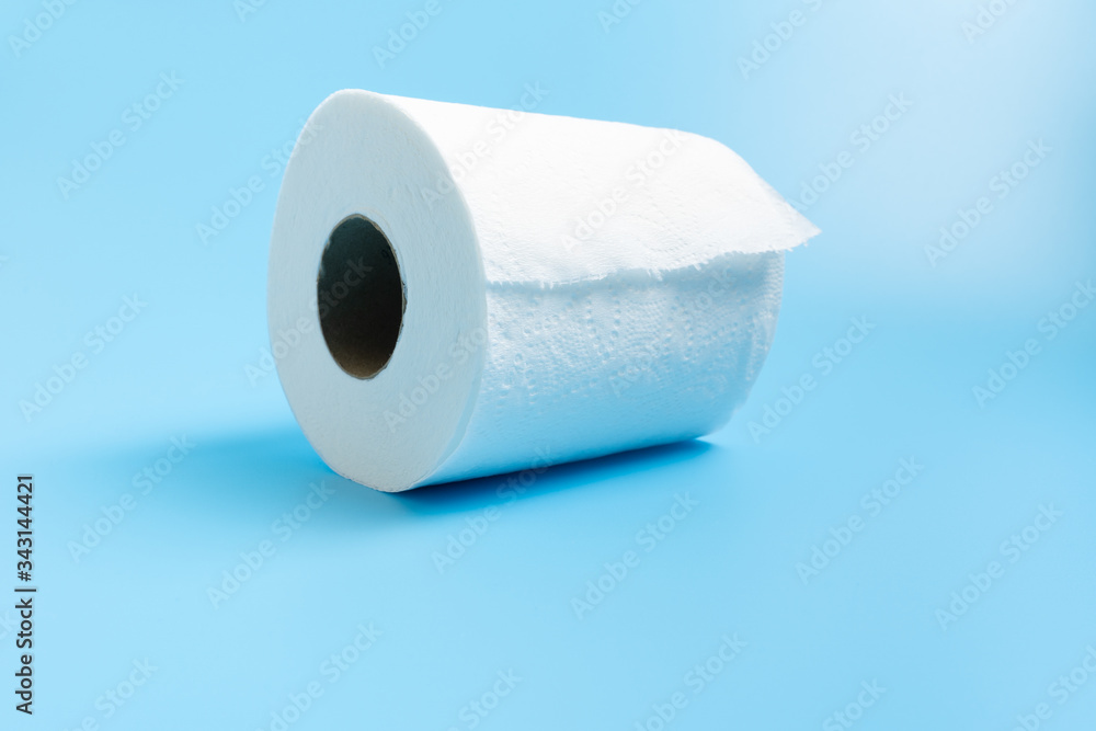 One toilet paper roll isolated on blue background One toilet paper roll isolated on blue background