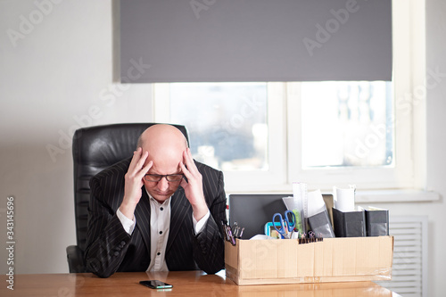 A man is sitting in his off...