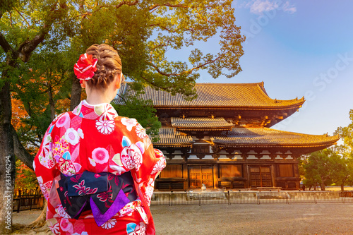 Japanese girl next to a Bud...
