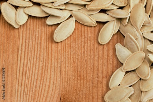 Pumpkin seeds on wood