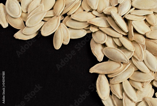 Pumpkin seeds on a black background